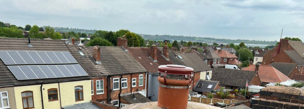 This is a photo taken from a roof which is being repaired by Crawley Roofing Repairs, it shows a street of houses, and their roofs