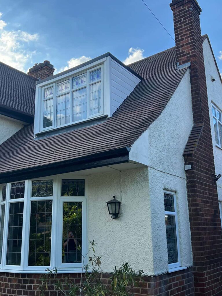 This is a photo of a dormer window which has just had some repairs carried out where the roof and the dormer meet. Works carried out by Crawley Roofing Repairs